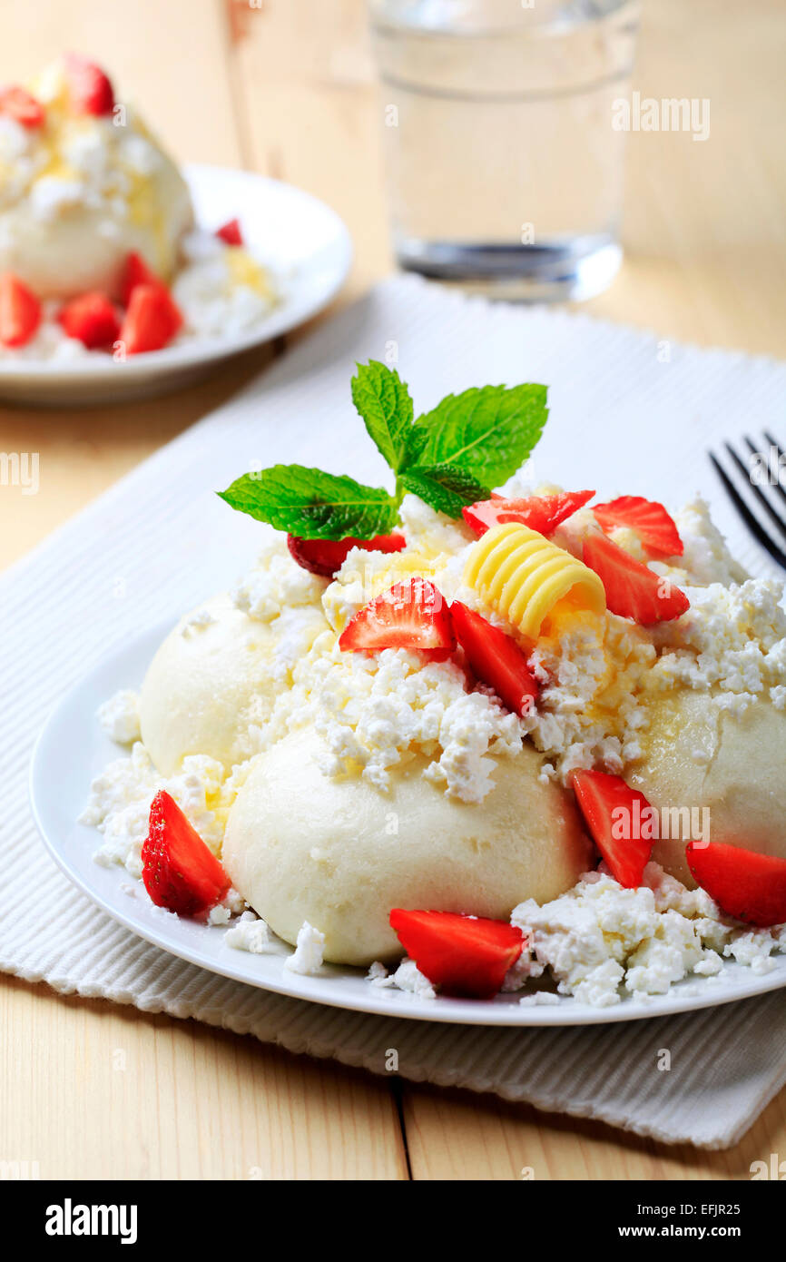 Strawberry dumplings with cottage cheese, sugar, butter and fresh strawberries Stock Photo