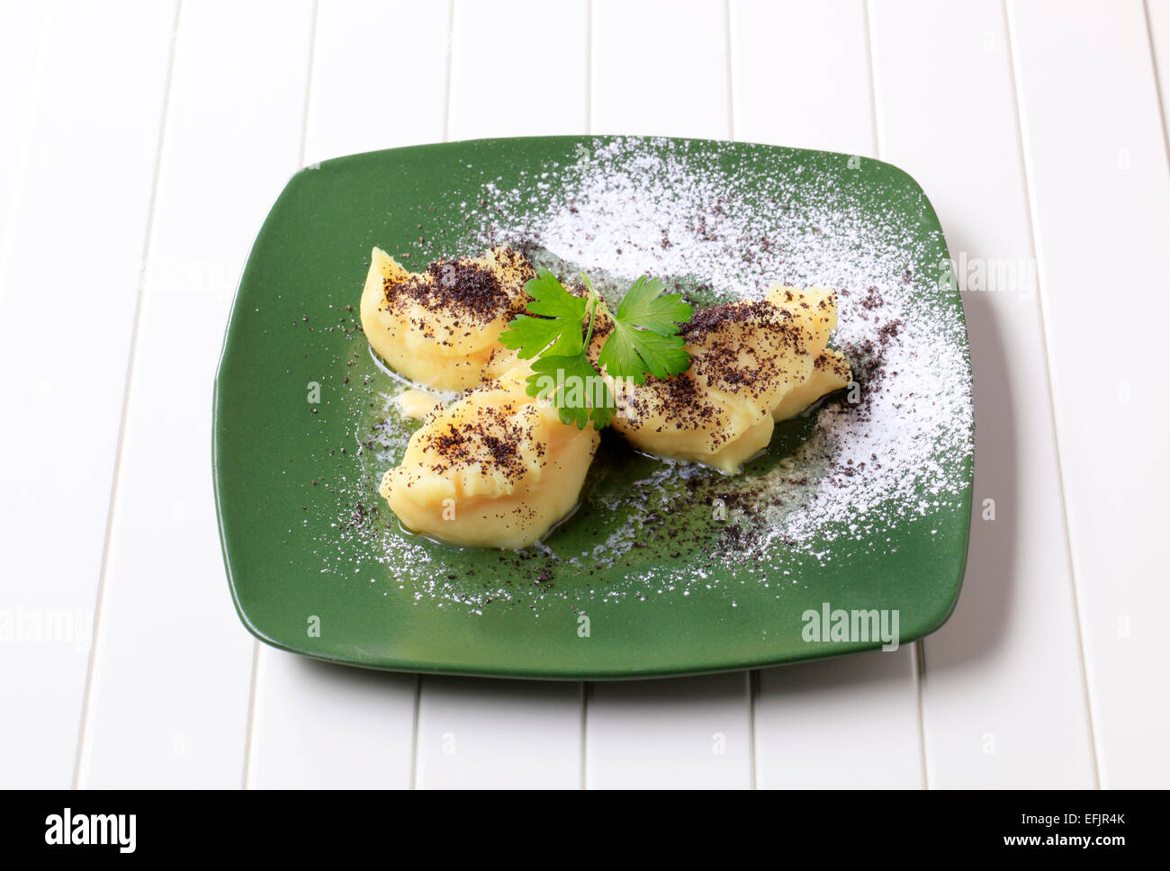 Lumps of potato puree with poppyseed and sugar Stock Photo