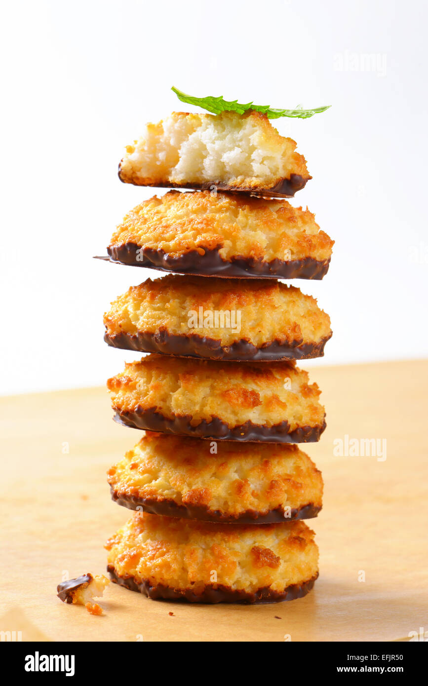 Pile of coconut macaroons dipped in chocolate Stock Photo