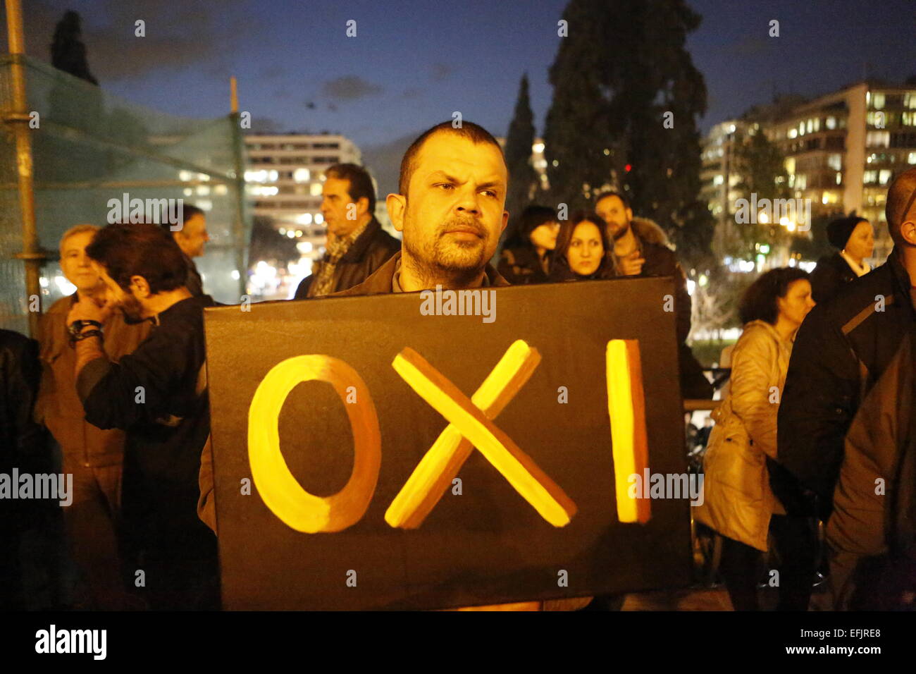 Athens, Greece. 5th Feb, 2015. A man holds a sign that reads 'No'. Thousands of Greeks assembled at Syntagma Square, to protest against the fiscal extortion by the Troika, who wants Greece to follow their instruction in return for providing needed money to the Greek banks. Credit:  Michael Debets/Pacific Press/Alamy Live News Stock Photo