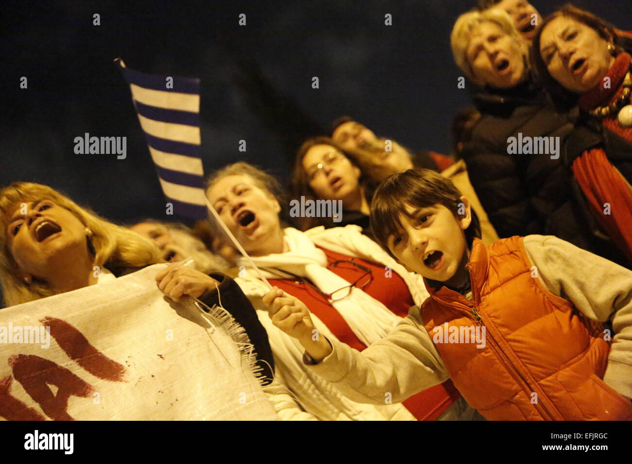 Athens, Greece. 5th Feb, 2015. A young boy waves a Greek flag. Thousands of Greeks assembled at Syntagma Square, to protest against the fiscal extortion by the Troika, who wants Greece to follow their instruction in return for providing needed money to the Greek banks. Credit:  Michael Debets/Pacific Press/Alamy Live News Stock Photo