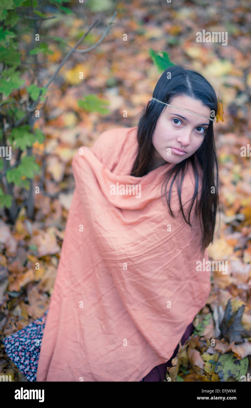 Sad lonely woman relaxing in romantic autumn forest park outdoor Stock Photo