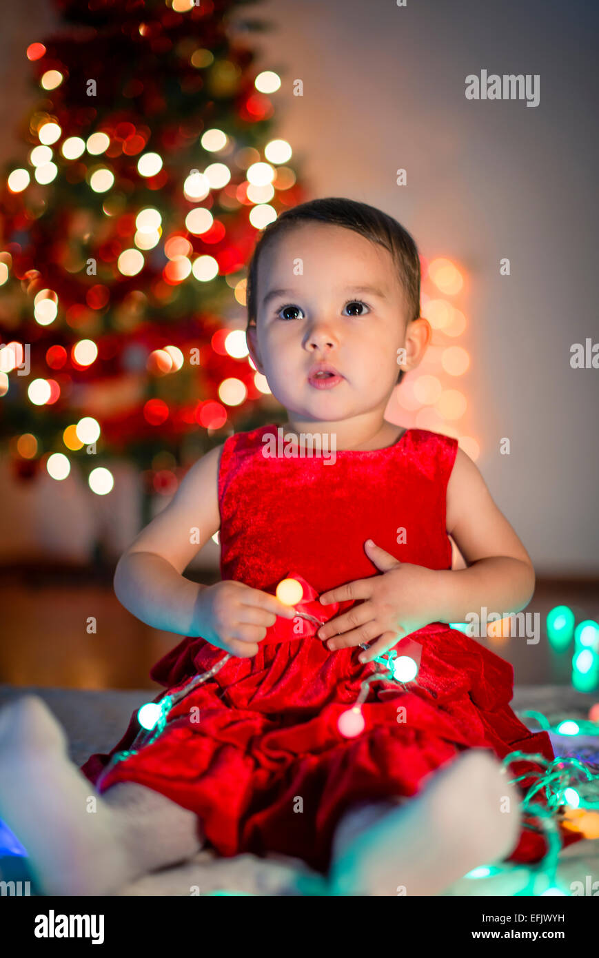 little girl with christmas lights Stock Photo Alamy