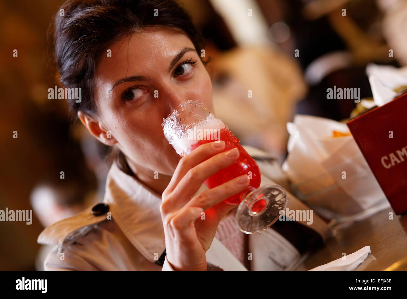Woman enjoying a drink inside a bar, Galleria Vittorio Emanuele II, Milan, Lombardy, Italy Stock Photo