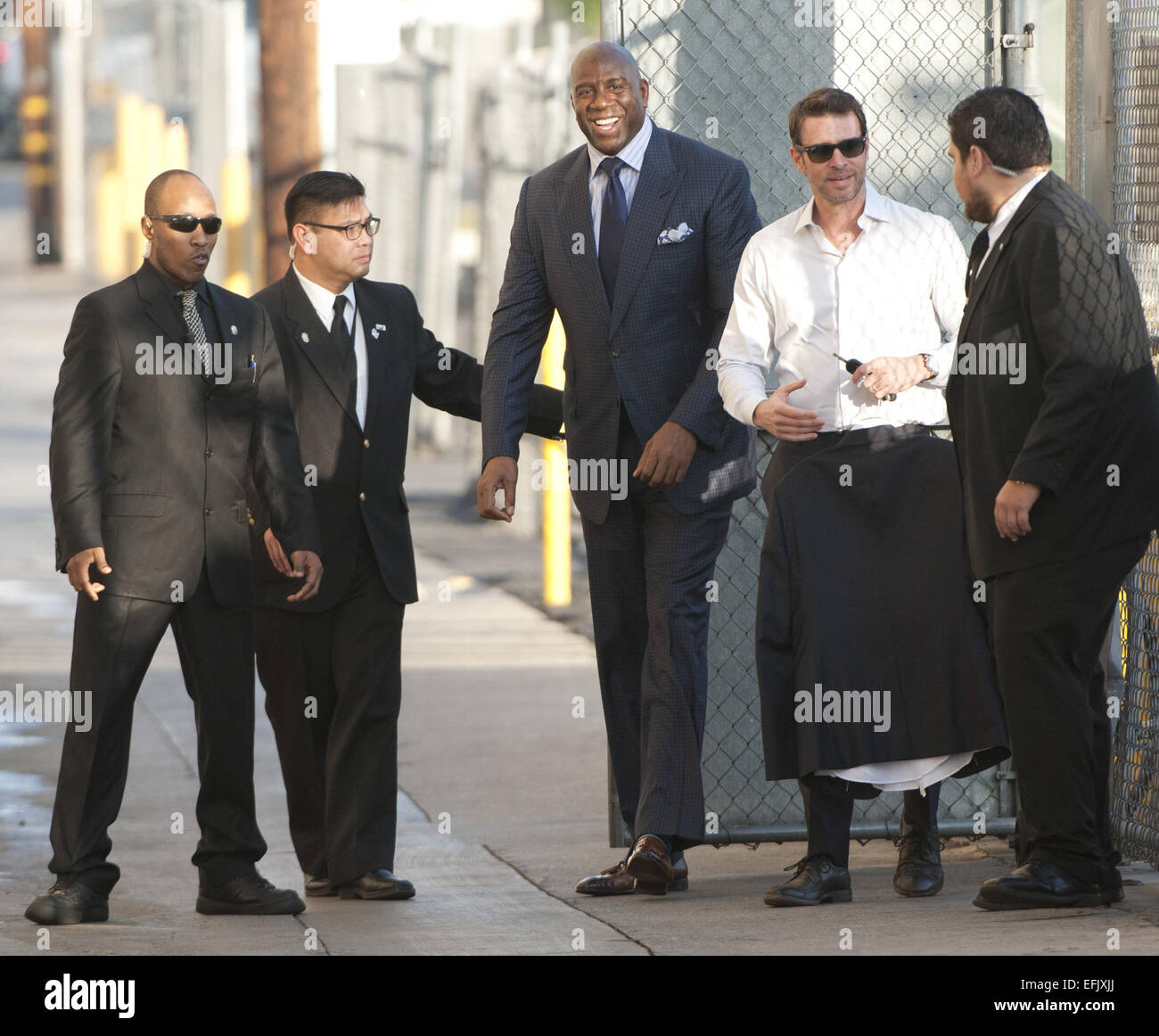 Hollywood, California, USA. 5th Feb, 2015. Former Lakers Basketball guard Magic Johnson, along with American actor, Scott Foley arrive at Jimmy Kimmel Live! in Hollywood, sneaking in and out on Thursday afternoon. Magic stopped momentarily to greet fans and sign autographs before going in for his appearance. Credit:  David Bro/ZUMA Wire/Alamy Live News Stock Photo