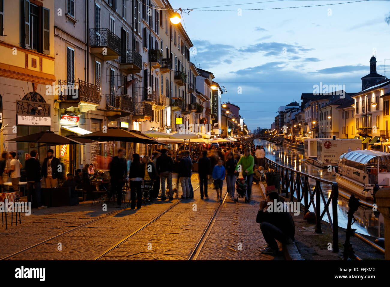 Restaurants and bars along a canal in the evening, Navigli quarter, Milan, Lombardy, Italy Stock Photo