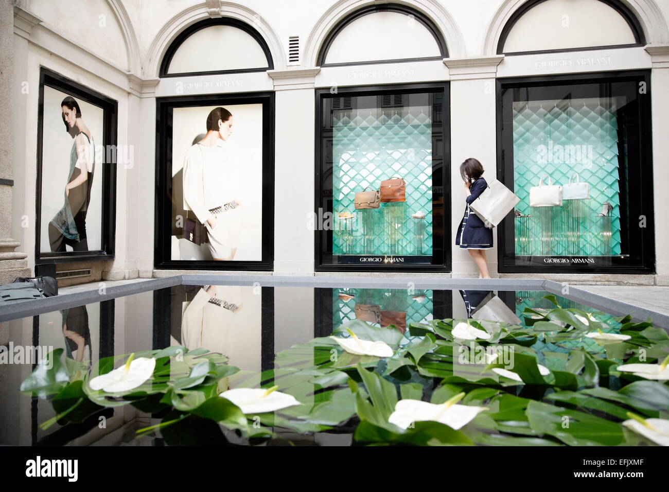 Woman window shopping, Via Montenapoleone, Golden Triangle, Milan, Lombardy, Italy Stock Photo