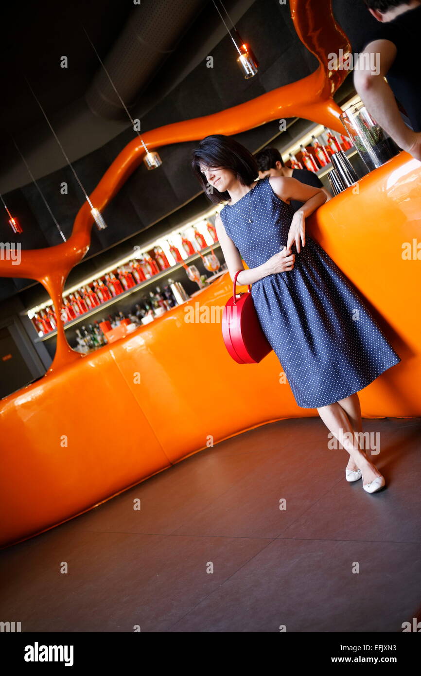 Woman inside a bar, Galleria Vittorio Emanuele II, Milan, Lombardy, Italy Stock Photo