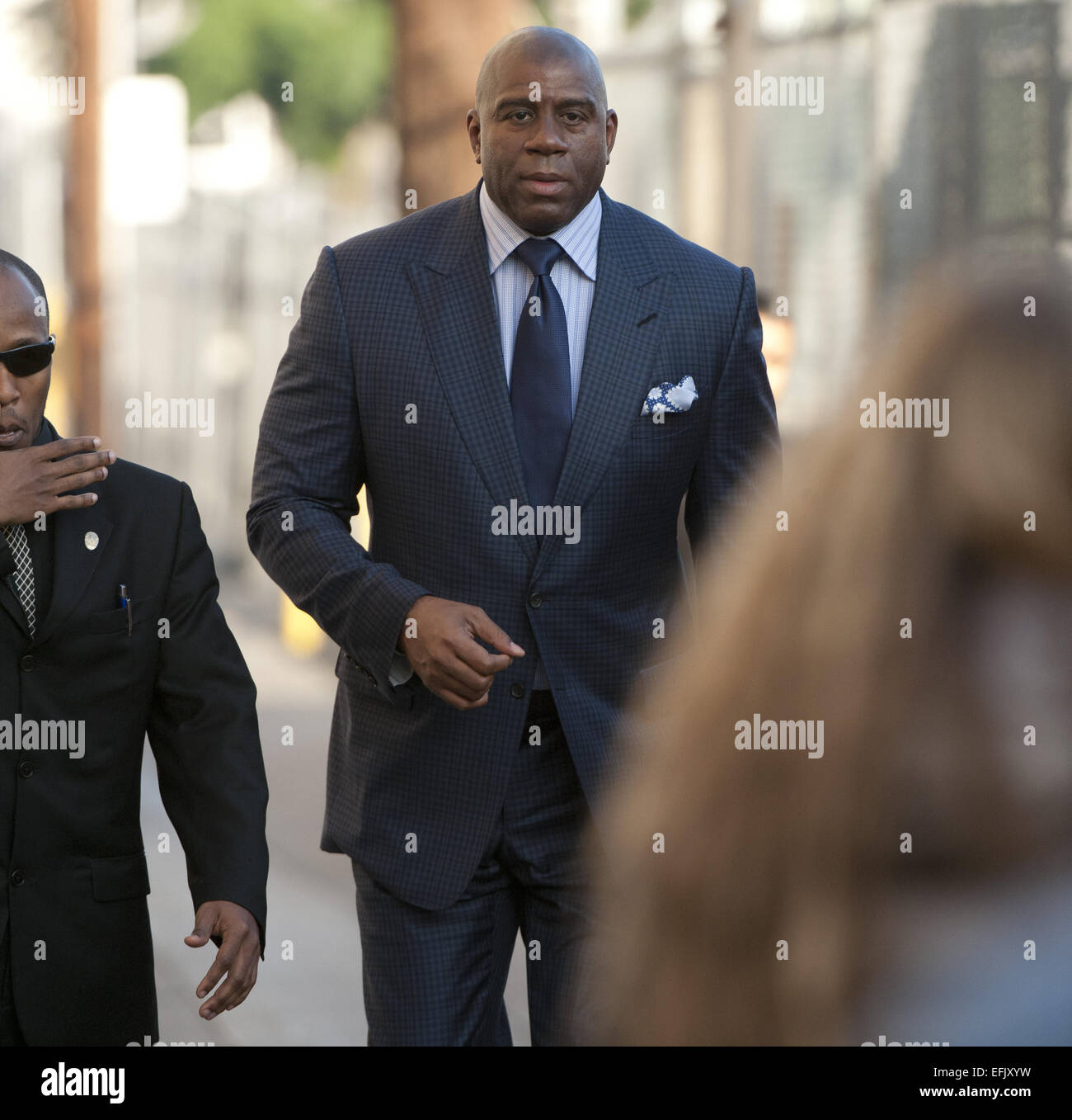 Hollywood, California, USA. 5th Feb, 2015. Former Lakers Basketball guard Magic Johnson, along with American actor, Scott Foley arrive at Jimmy Kimmel Live! in Hollywood, sneaking in and out on Thursday afternoon. Magic stopped momentarily to greet fans and sign autographs before going in for his appearance. Credit:  David Bro/ZUMA Wire/Alamy Live News Stock Photo