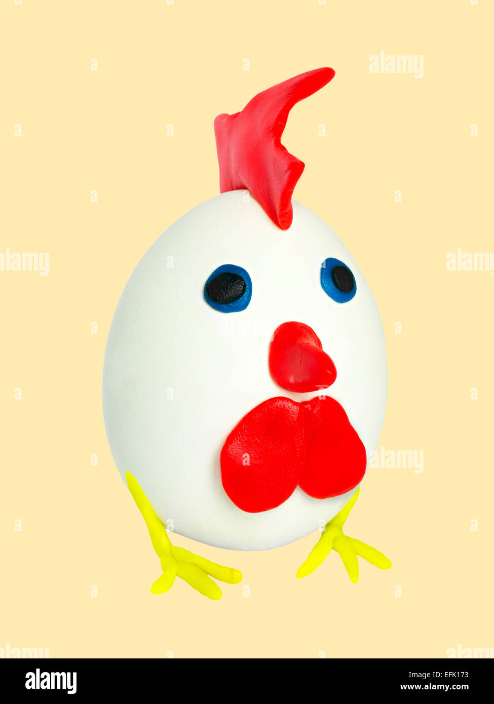 artifact of the eggs and plasticine isolated on yellow background Stock Photo