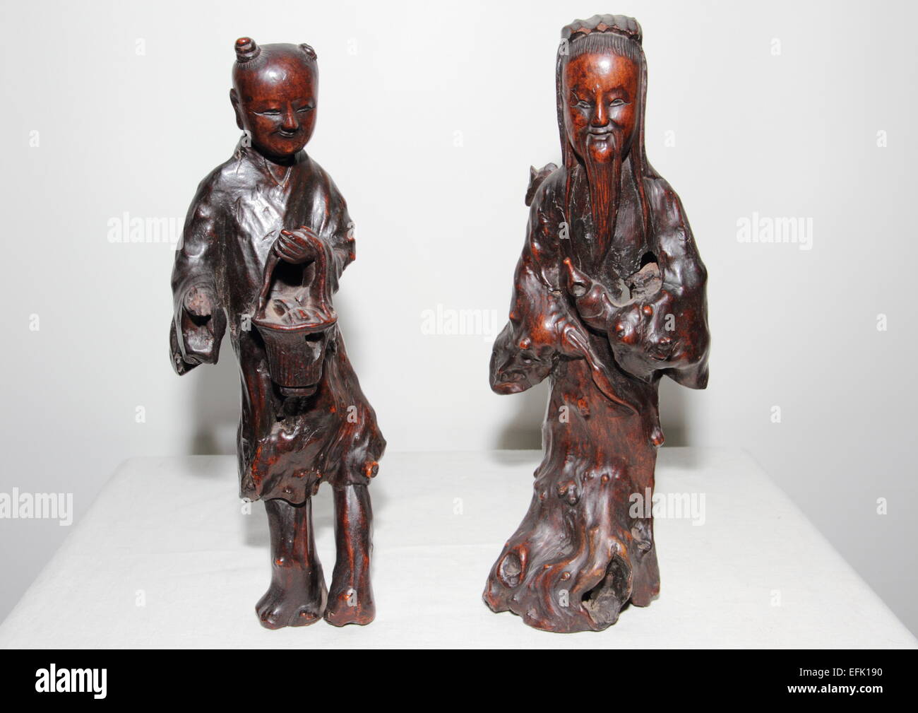 Two Chinese wooden carved figures Stock Photo