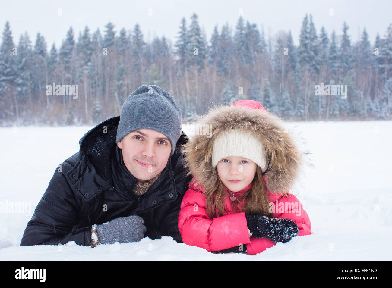 Happy family enjoy winter snowy day Stock Photo - Alamy