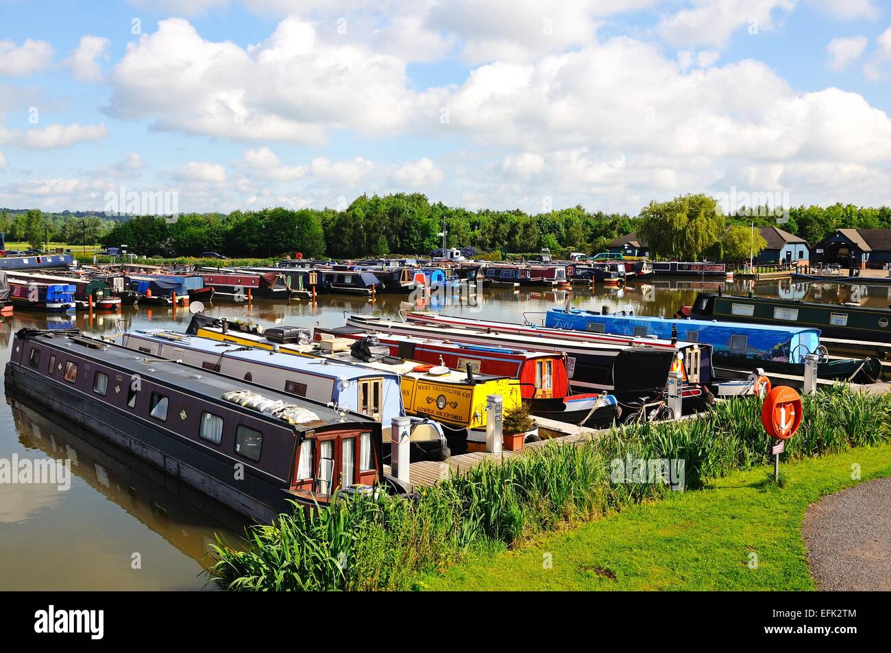 Narrowboats on their moorings in the canal basin, Barton Marina, Barton