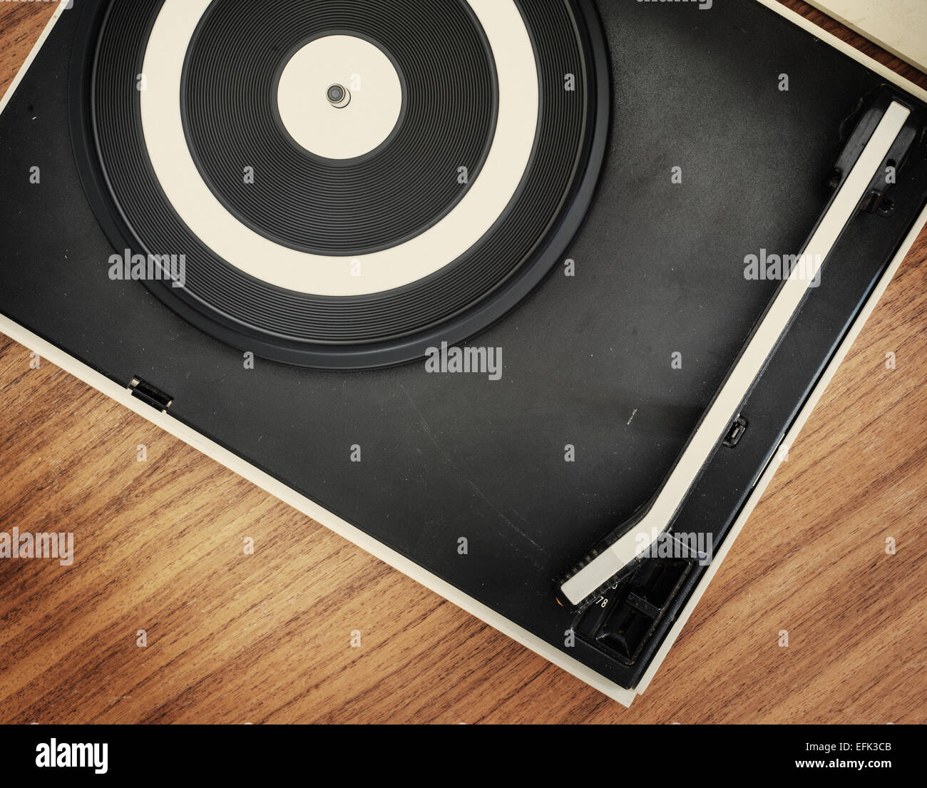Old fashioned record player on wooden table Stock Photo