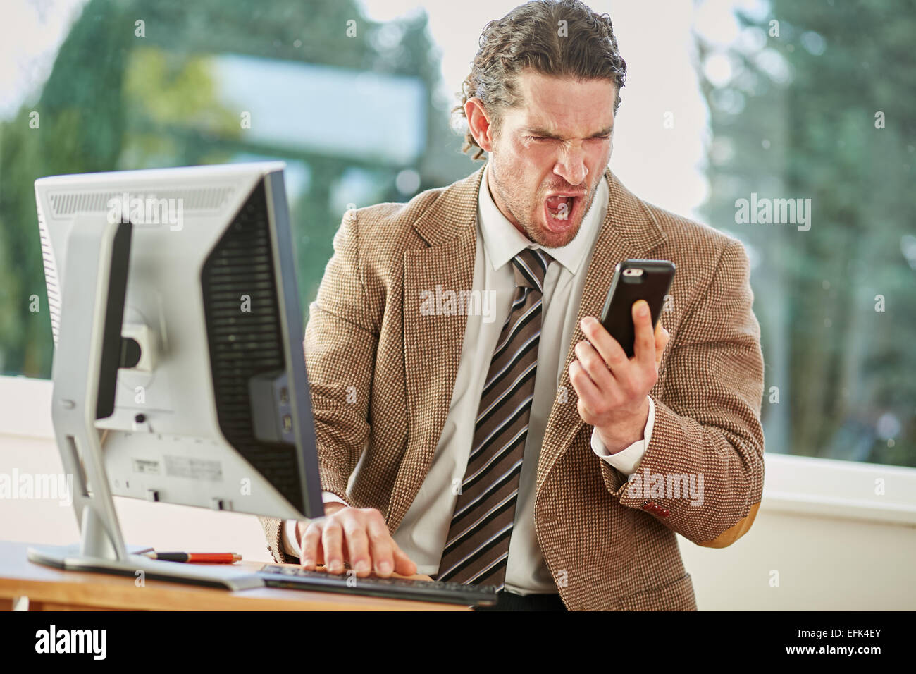 Man stressed out at work Stock Photo