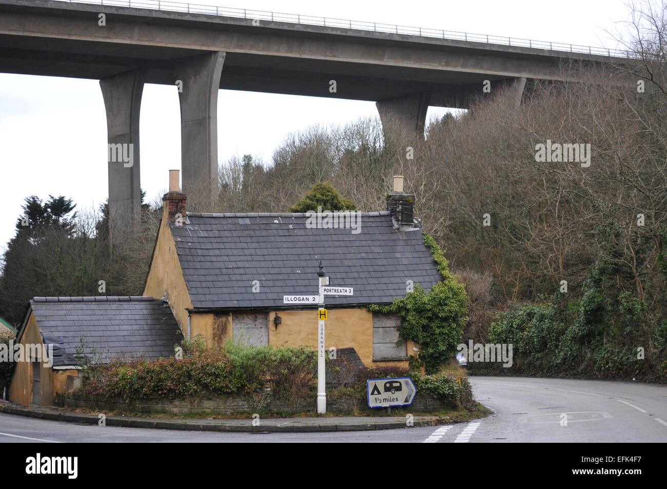 An abandoned house in Cornwall showing the A30 flyover in the background Stock Photo