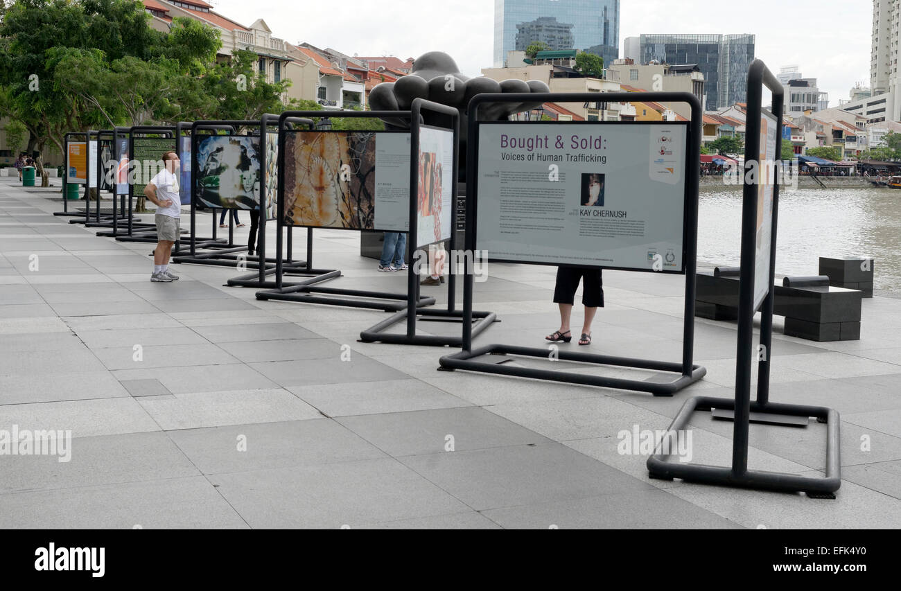 Human trafficking exhibition display along Boat Quay in Singapore Asia Stock Photo