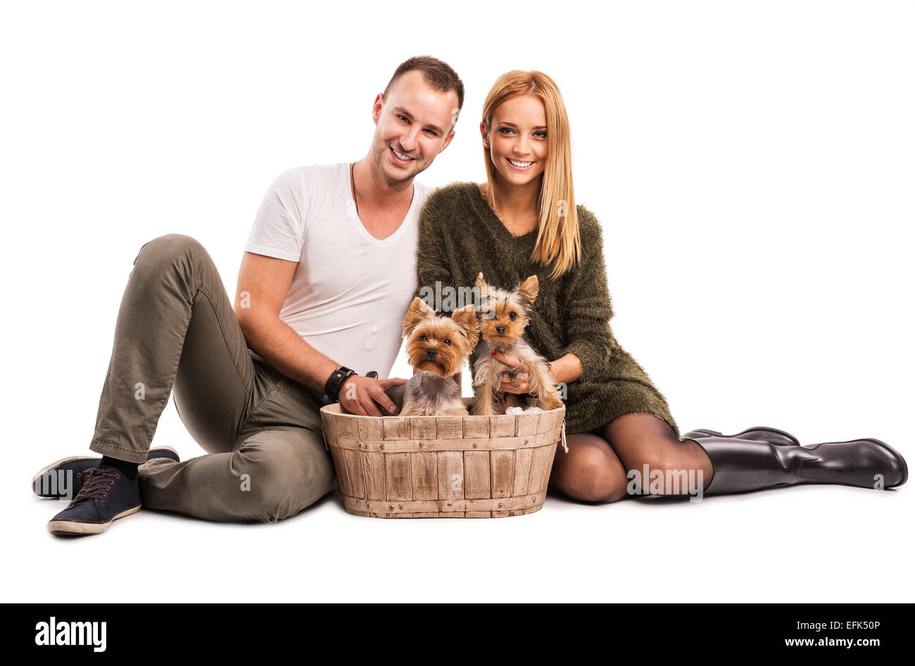 Love Couple with two yorkshire terrier in basket  - autumn fashion Stock Photo
