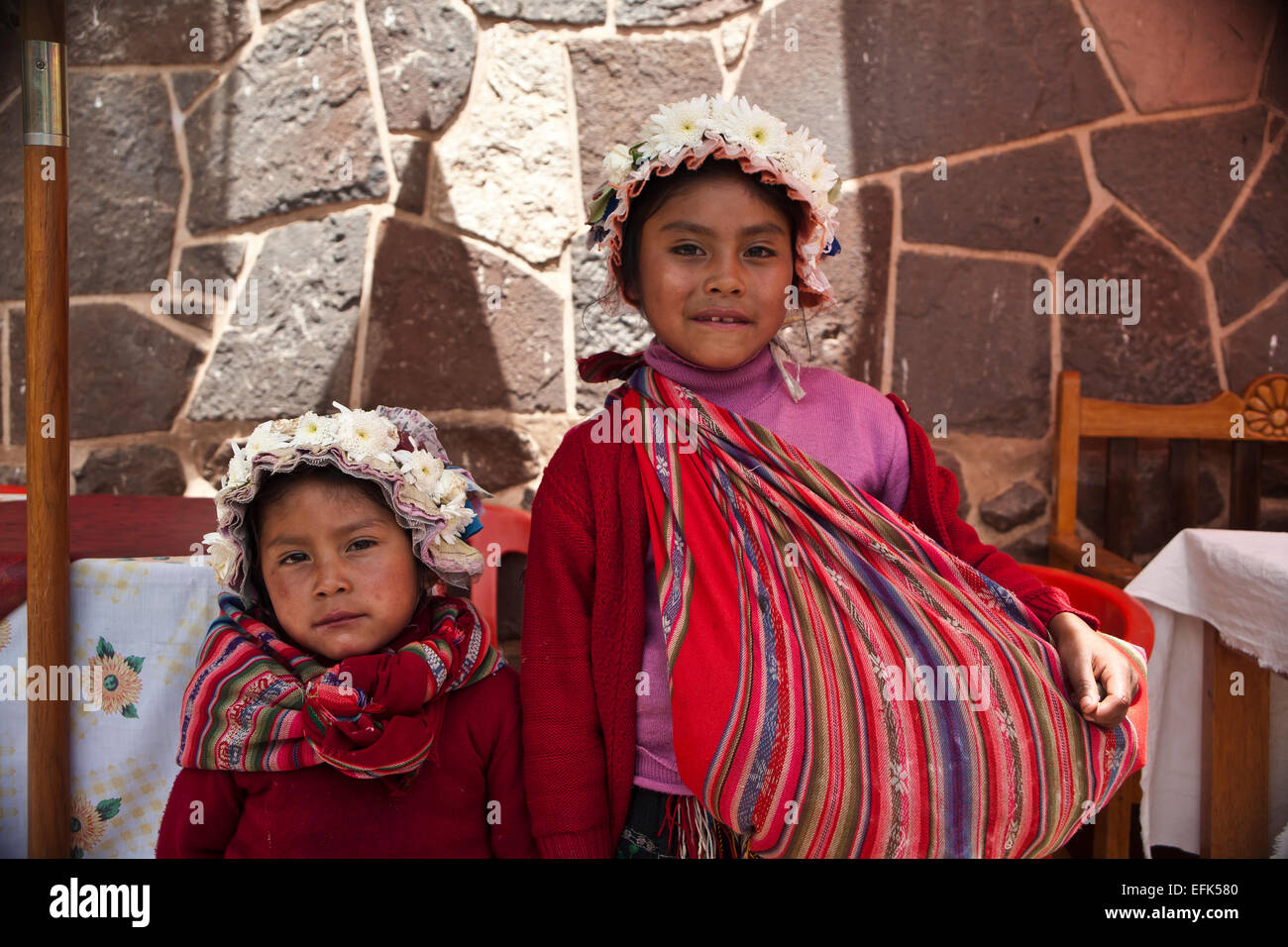 Two girls in traditional dress at Pisac market, Peru. Stock Photo