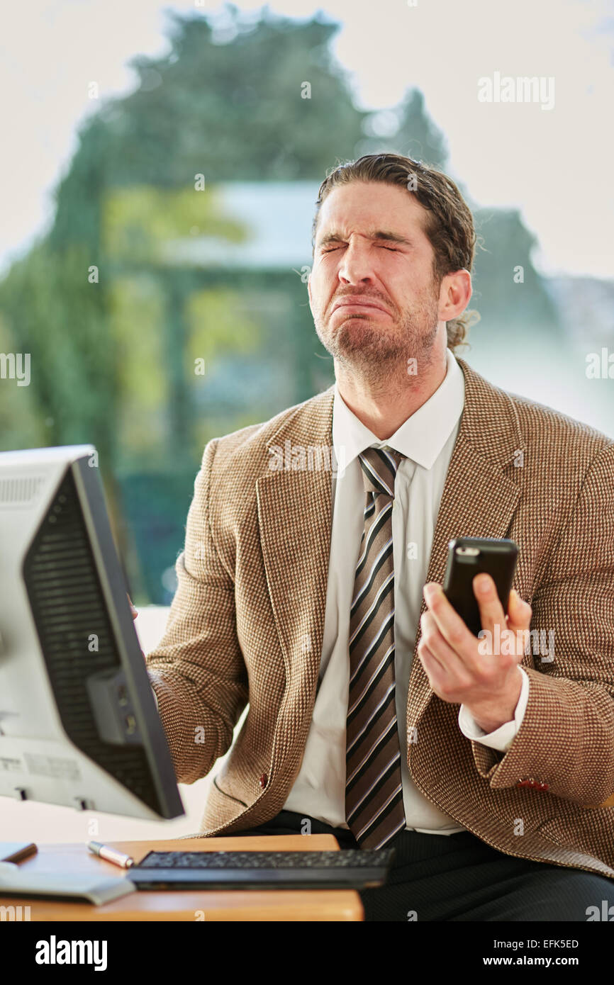 Man stressed out at work Stock Photo