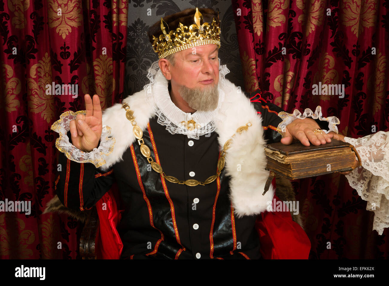 Royal king swearing a solemn oath at his inauguration Stock Photo