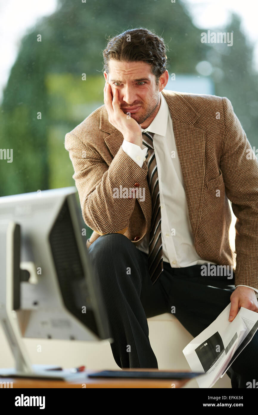 Man stressed out at work Stock Photo