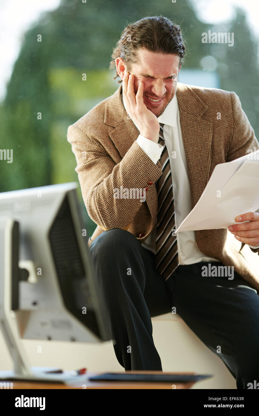 Man stressed out at work Stock Photo