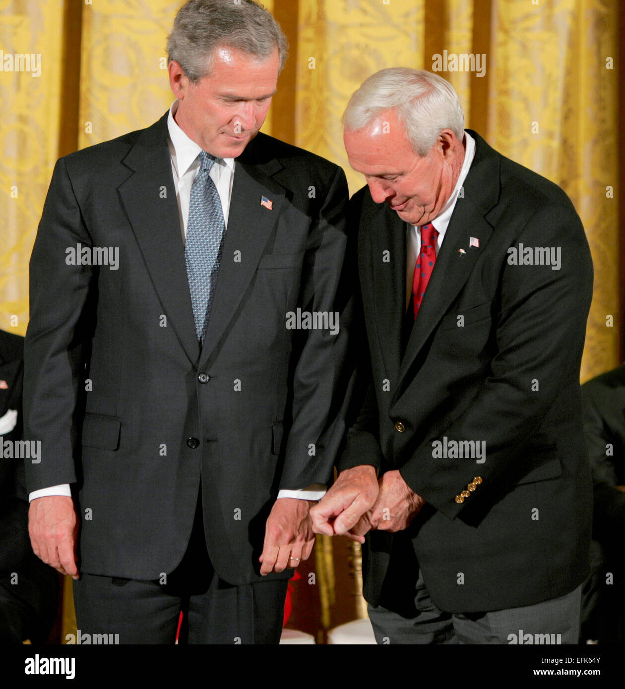 US President George W. Bush gets a golfing tip from Arnold Palmer during the Presidential Medal of Freedom Award Ceremony June 23, 2004 in Washington, DC. Stock Photo
