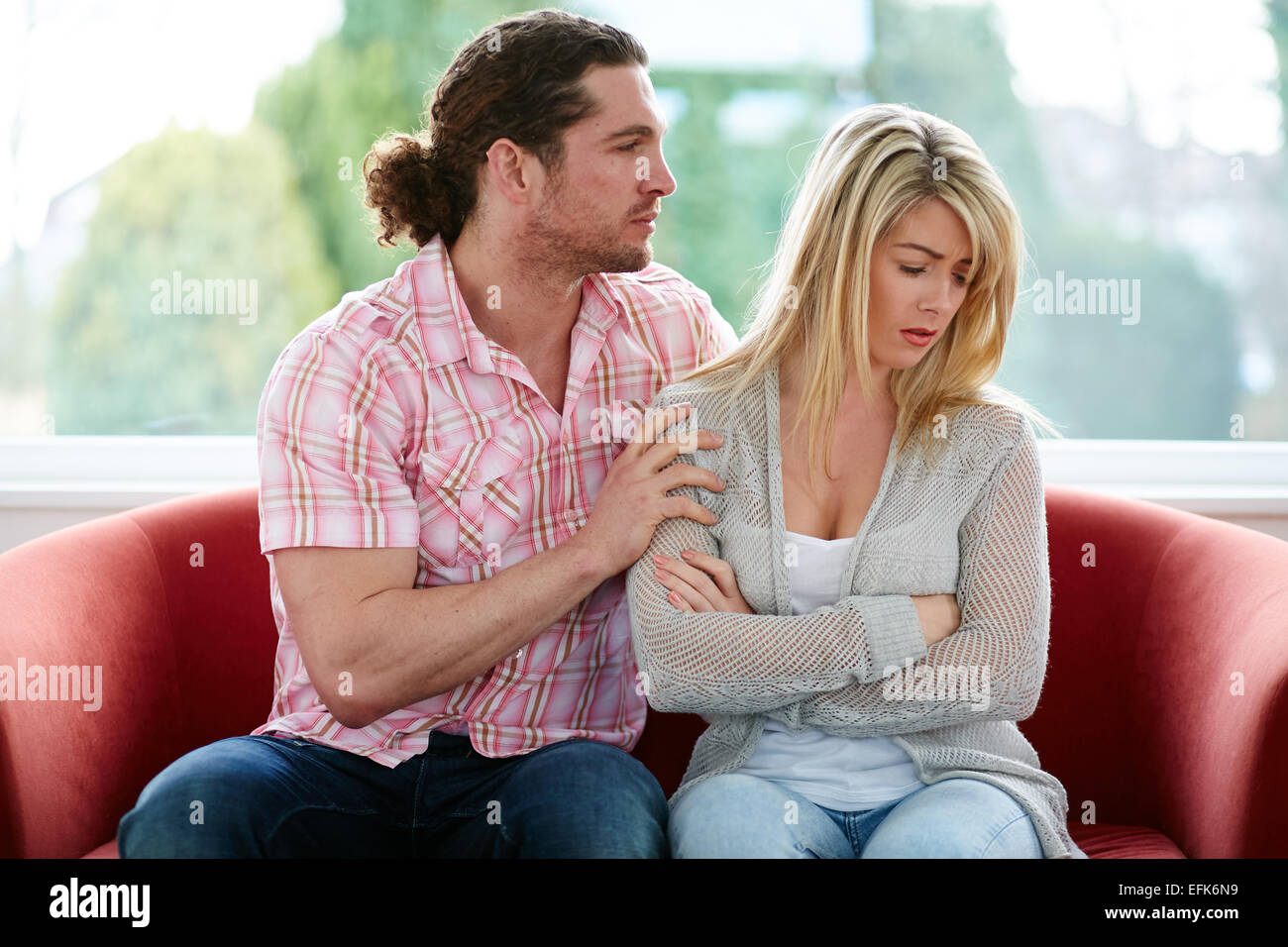 Man consoling woman Stock Photo