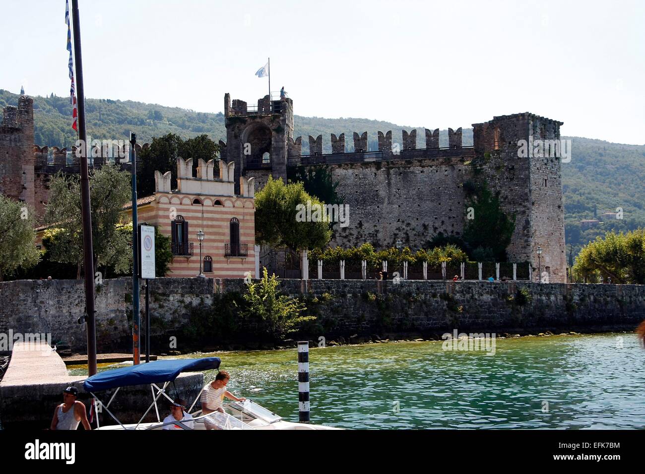 Scaliger Castle in Torri del Benaco was built in 1383 to protect the harbor. Torri del Benaco is a town on the eastern shore of Lake Garda. Photo: Klaus Nowottnick Date: August 27, 2014 Stock Photo