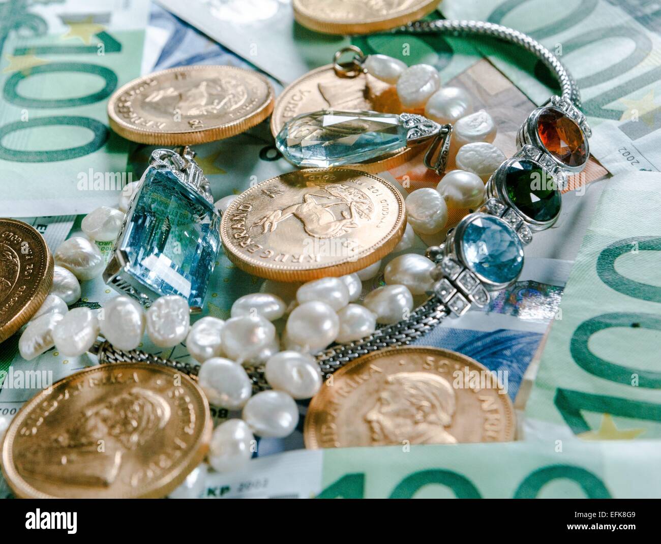 Gold, money and jewelry Stock Photo Alamy