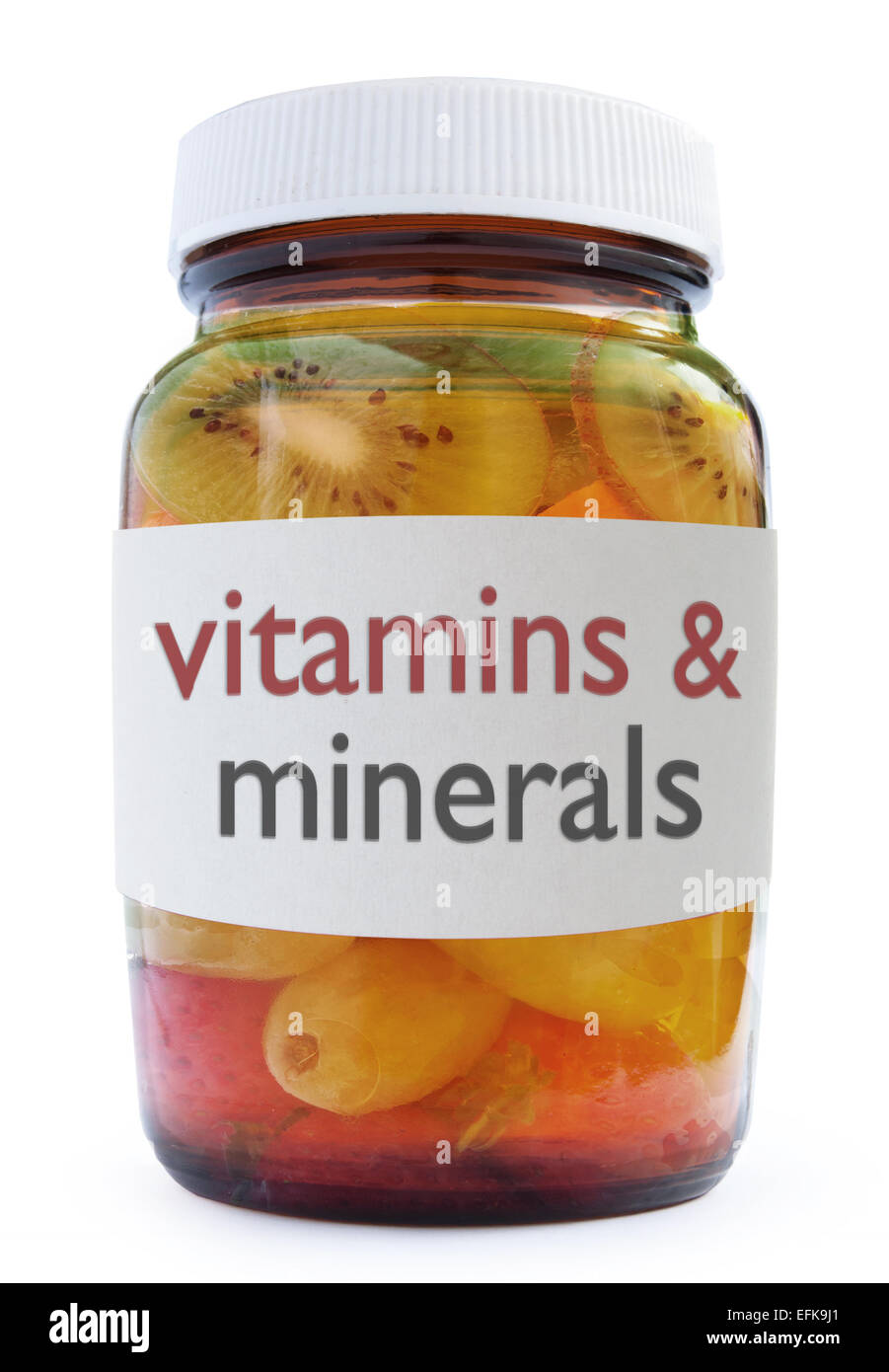 Vitamins and minerals medicine bottle packed with fruit over a white background Stock Photo