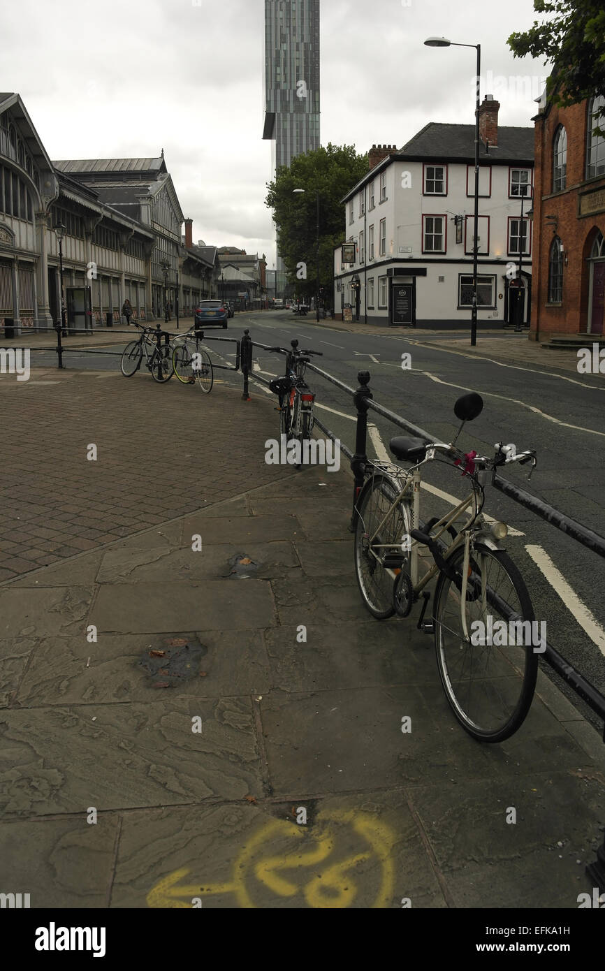 Grey sky portrait, to Beetham Tower, Lower Campsfield Market, Oxnoble Pub, bicycles secured railings Liverpool Road, Manchester Stock Photo