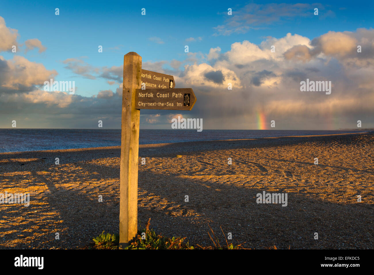 Coastal path on Cley beach Norfolk and coming storm in winter Stock Photo