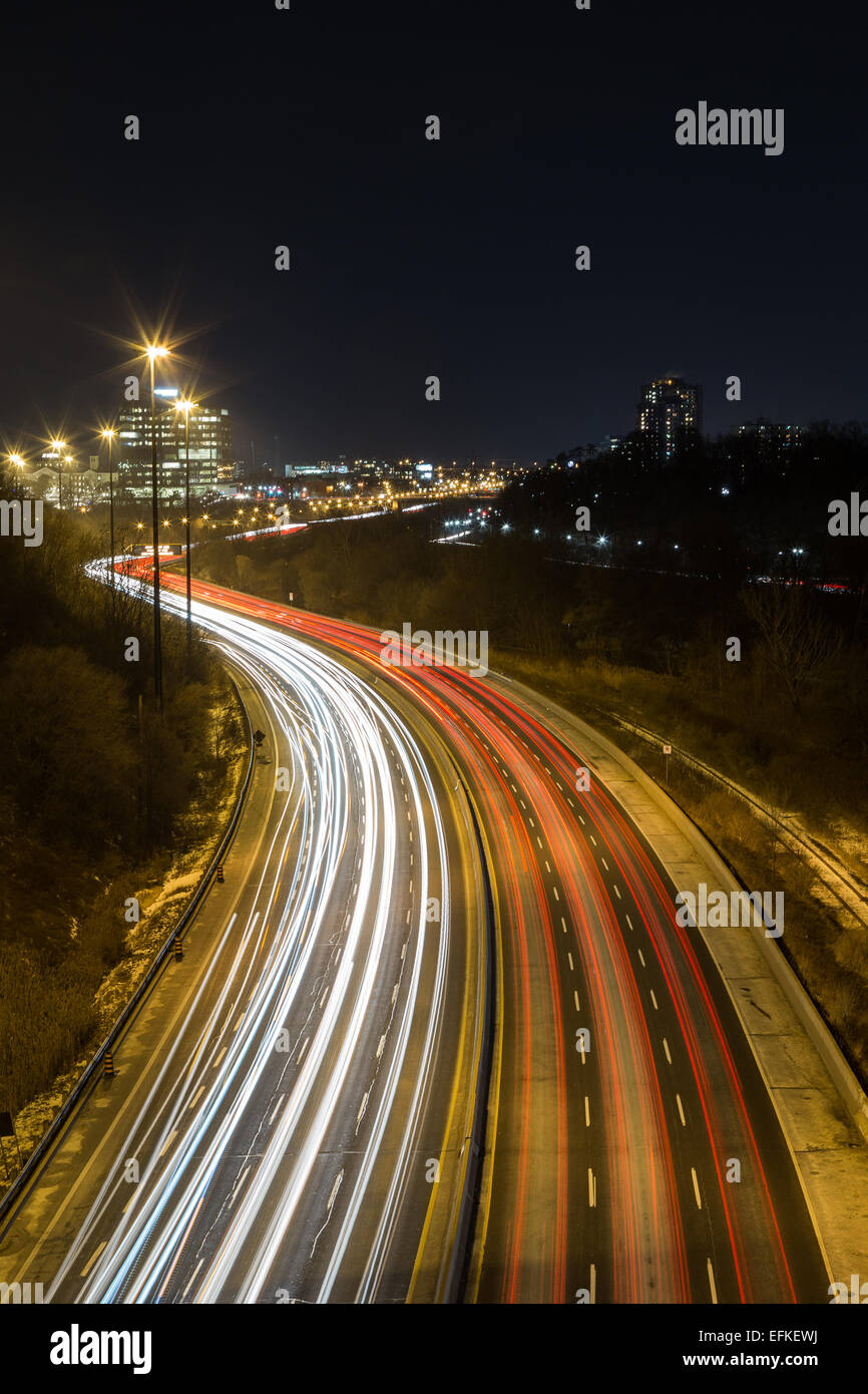 A view of Light trails on a highway Stock Photo