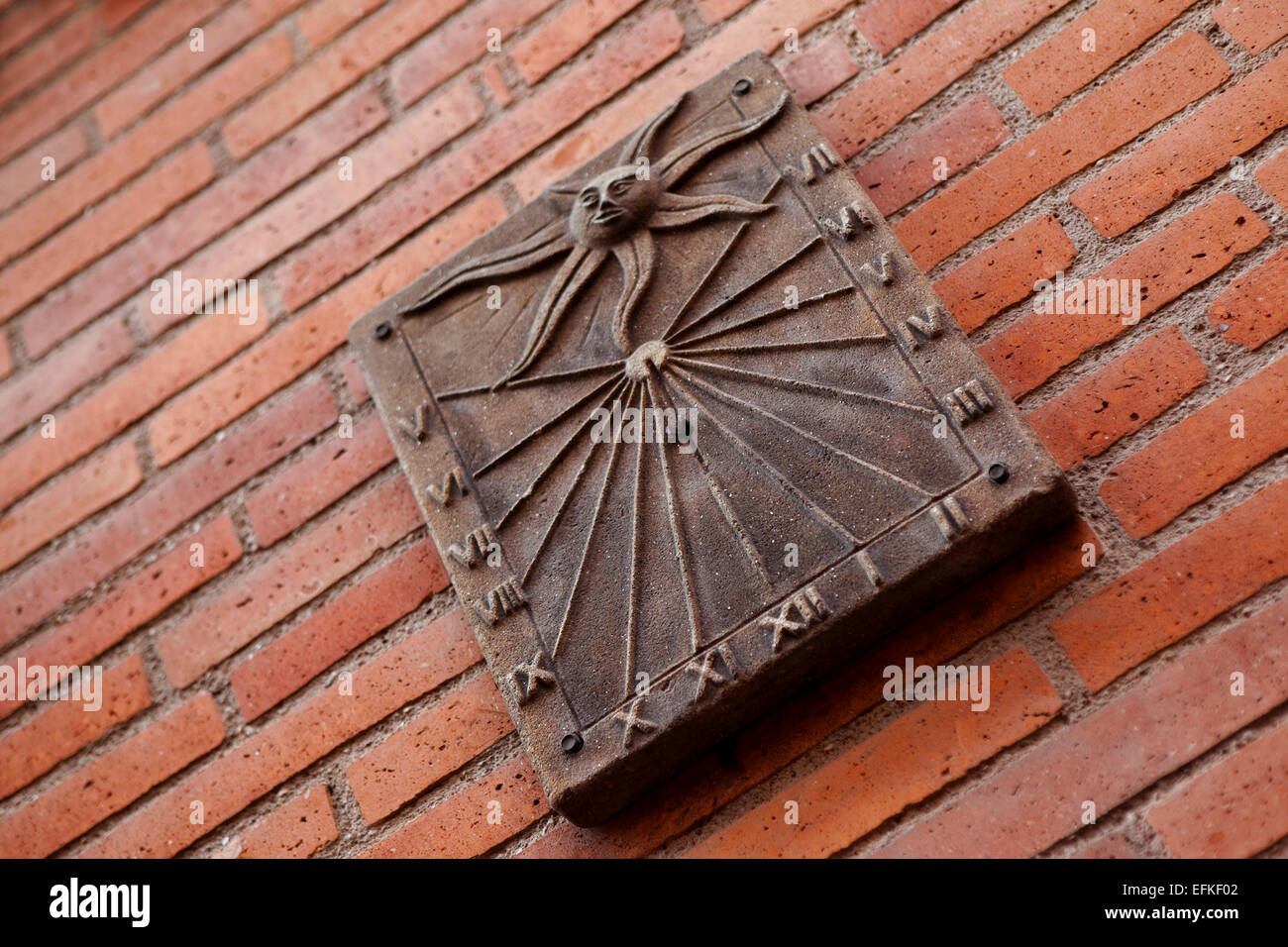 Sundial on a brick wall Stock Photo - Alamy