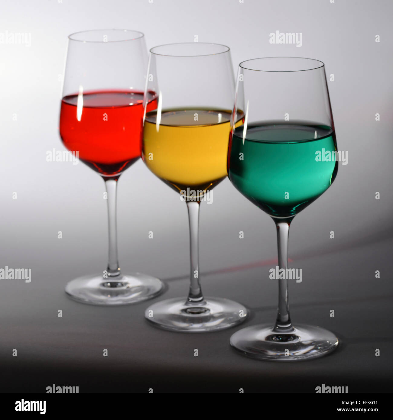 Three Wine Glasses Filled With Red Yellow And Green Colored Liquid Stock Photo Alamy