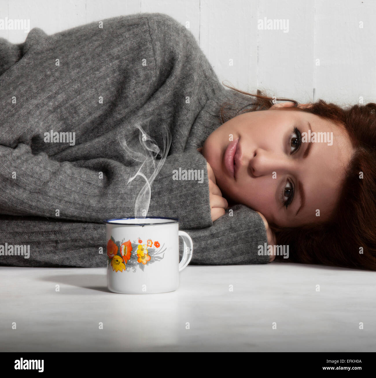 Depressed girl lying on floor hi-res stock photography and images - Alamy