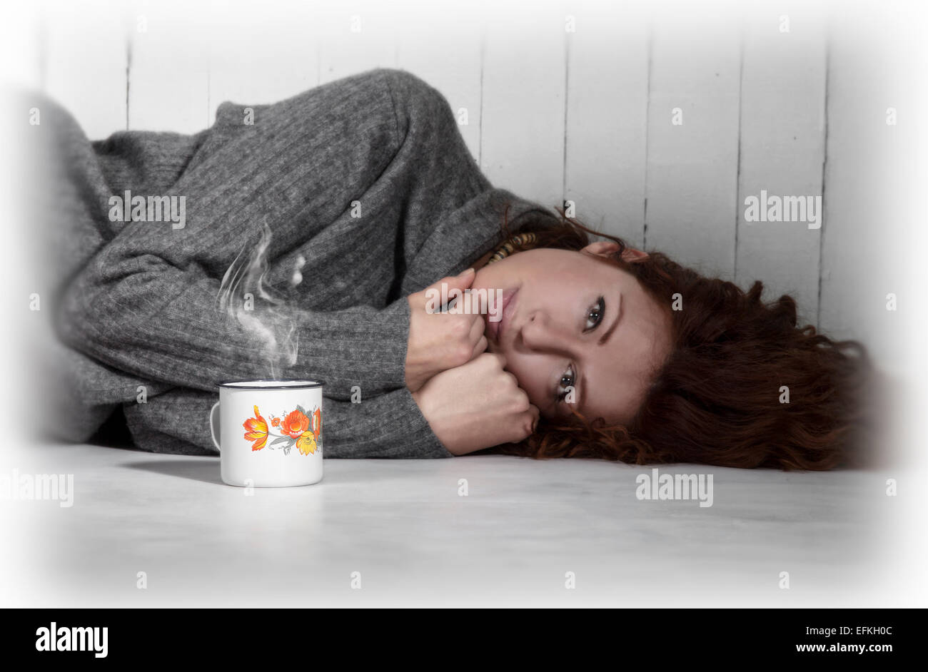 Depressed girl lying on floor hi-res stock photography and images - Alamy