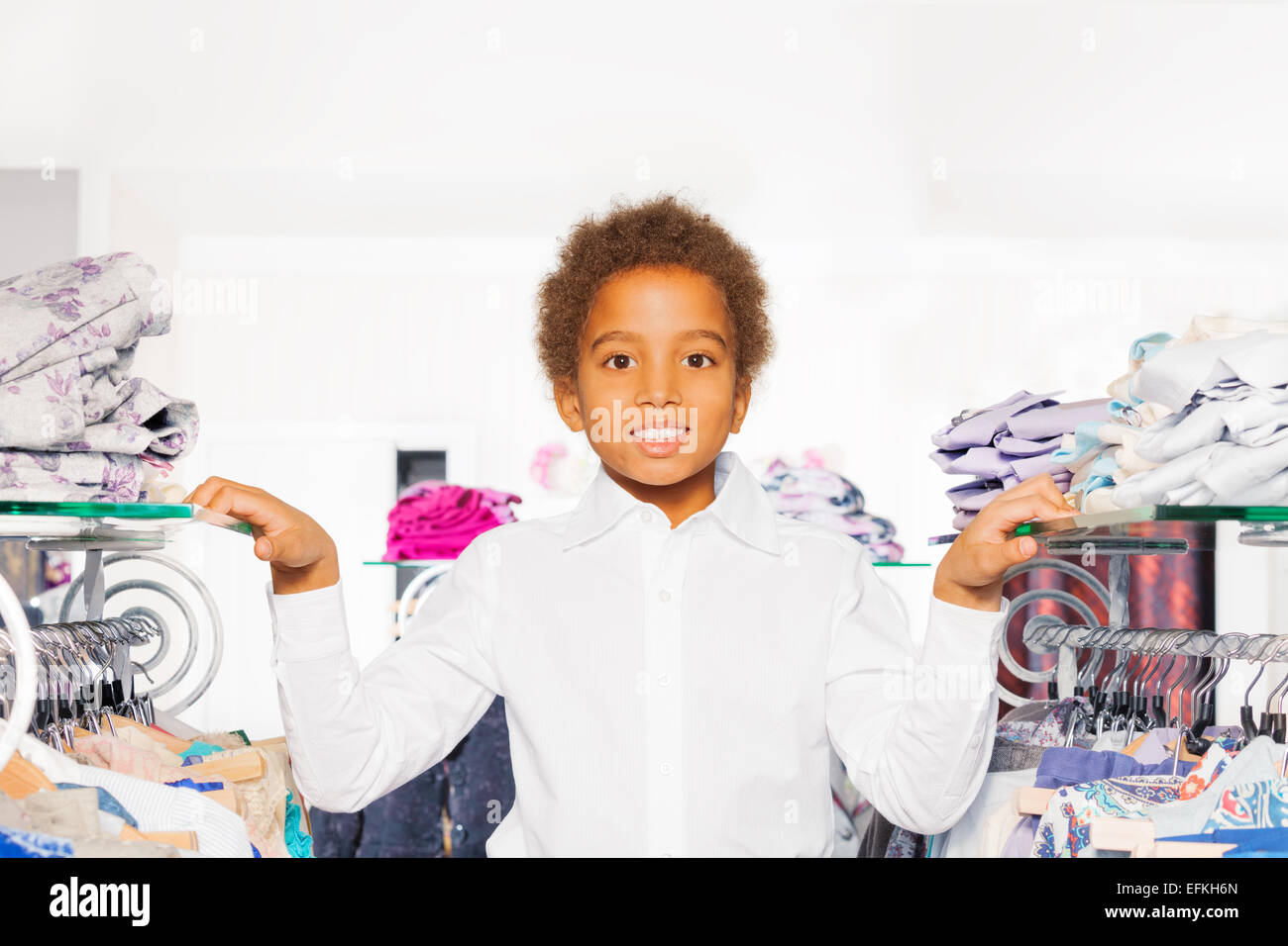 Close-up view of African boy in clothes store Stock Photo