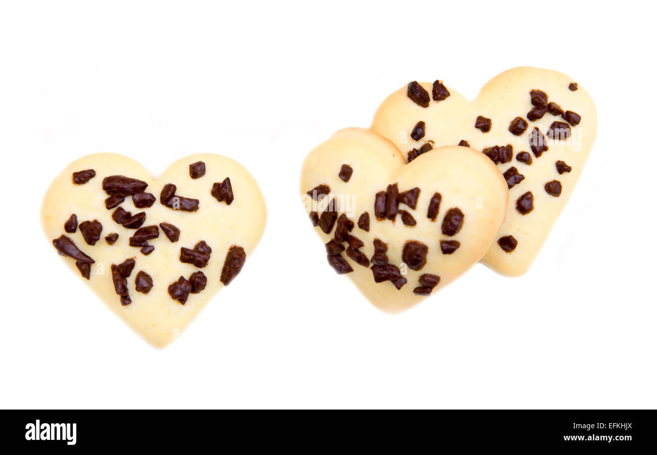Heart-shaped cookies with chocolate on white background seen from above Stock Photo