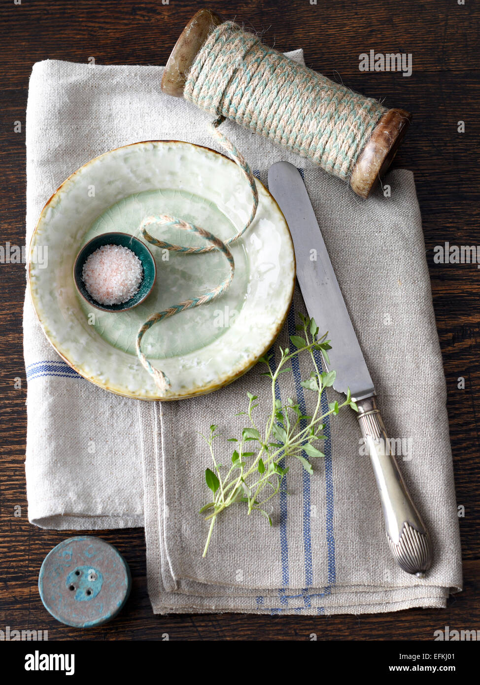 Saucer, string, knife, herb, kitchen towel Stock Photo Alamy