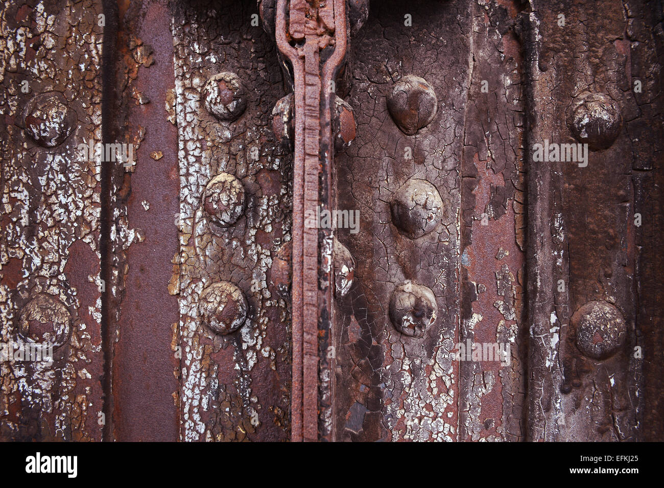 Rusted metal background with bolts and rivets Stock Photo