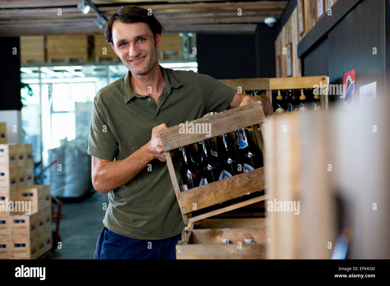 Man working in wine warehouse Stock Photo Alamy