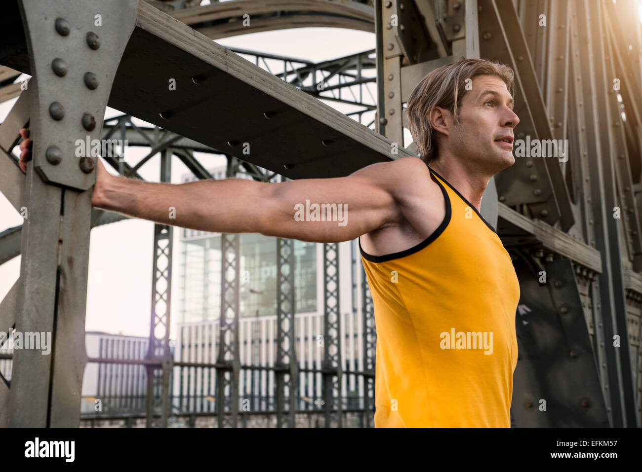 Man stretching on bridge munich hi-res stock photography and images - Alamy