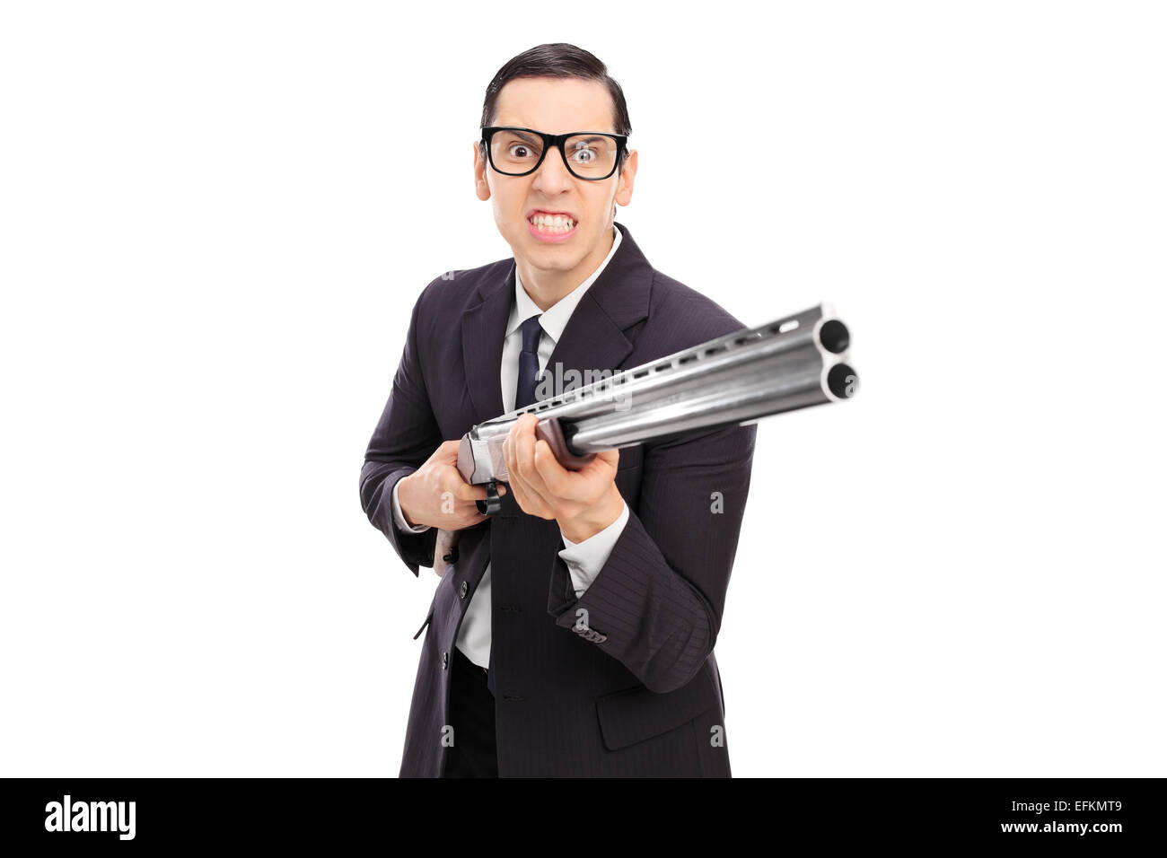 Angry businessman holding a shotgun isolated on white background Stock Photo