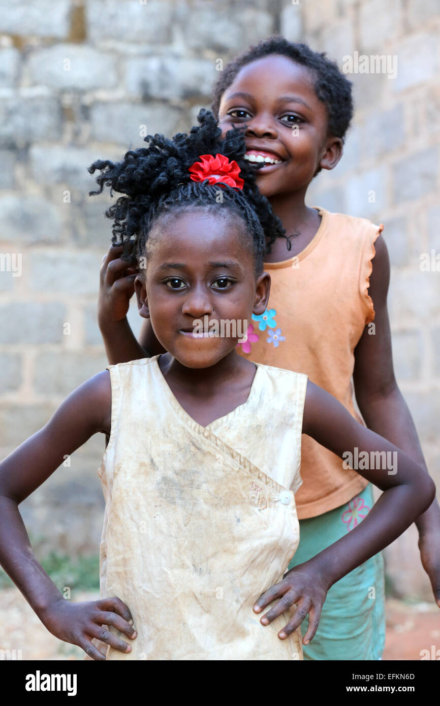two girls flirting withe the camera of the photographer. Ndola, Zambia, Africa Stock Photo