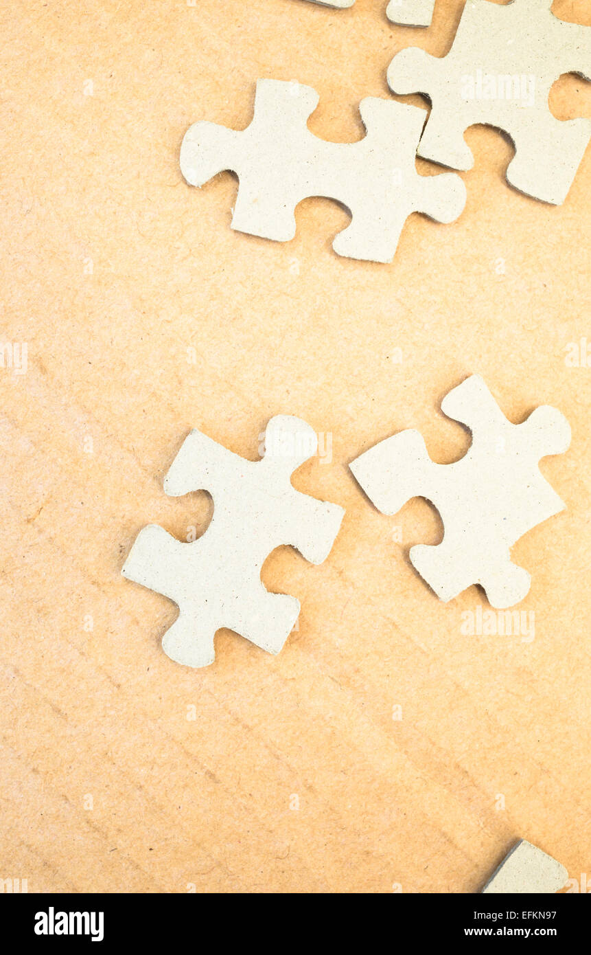 jigsaw puzzle pieces on a paperboard surface Stock Photo Alamy