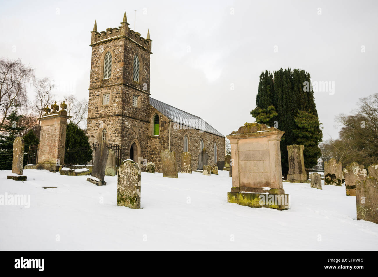 Church graveyard covered in snow. Stock Photo