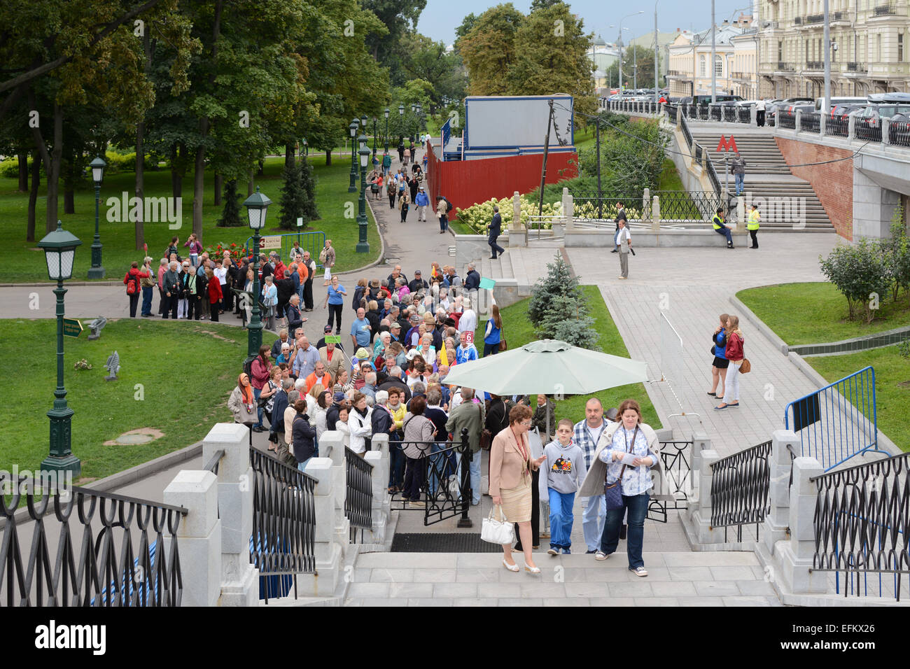 MOSCOW, RUSSIA - 24 AugUST 2014:  tourists queuing in Alexander Garden outside the entrance to the Kremlin Stock Photo